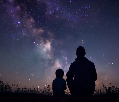 Parent and child stargazing